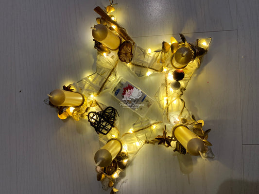 Centre de table étoile lumineuse avec bougies dorées